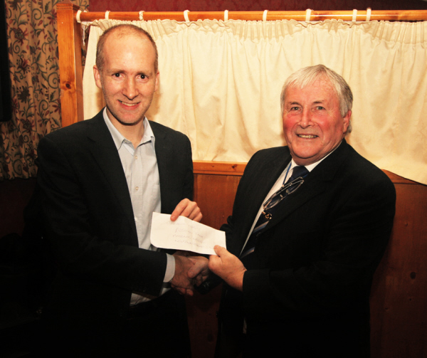 Robin McCallan presenting a cheque