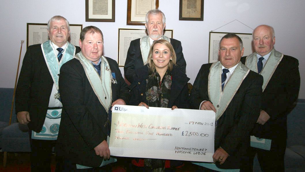 Gemma McCallan receiving the cheque 