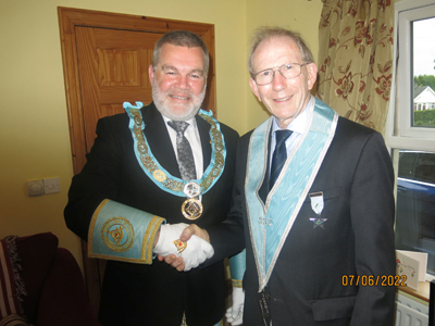 The Provincial Grand Master congratulating RWBro Jim McBain